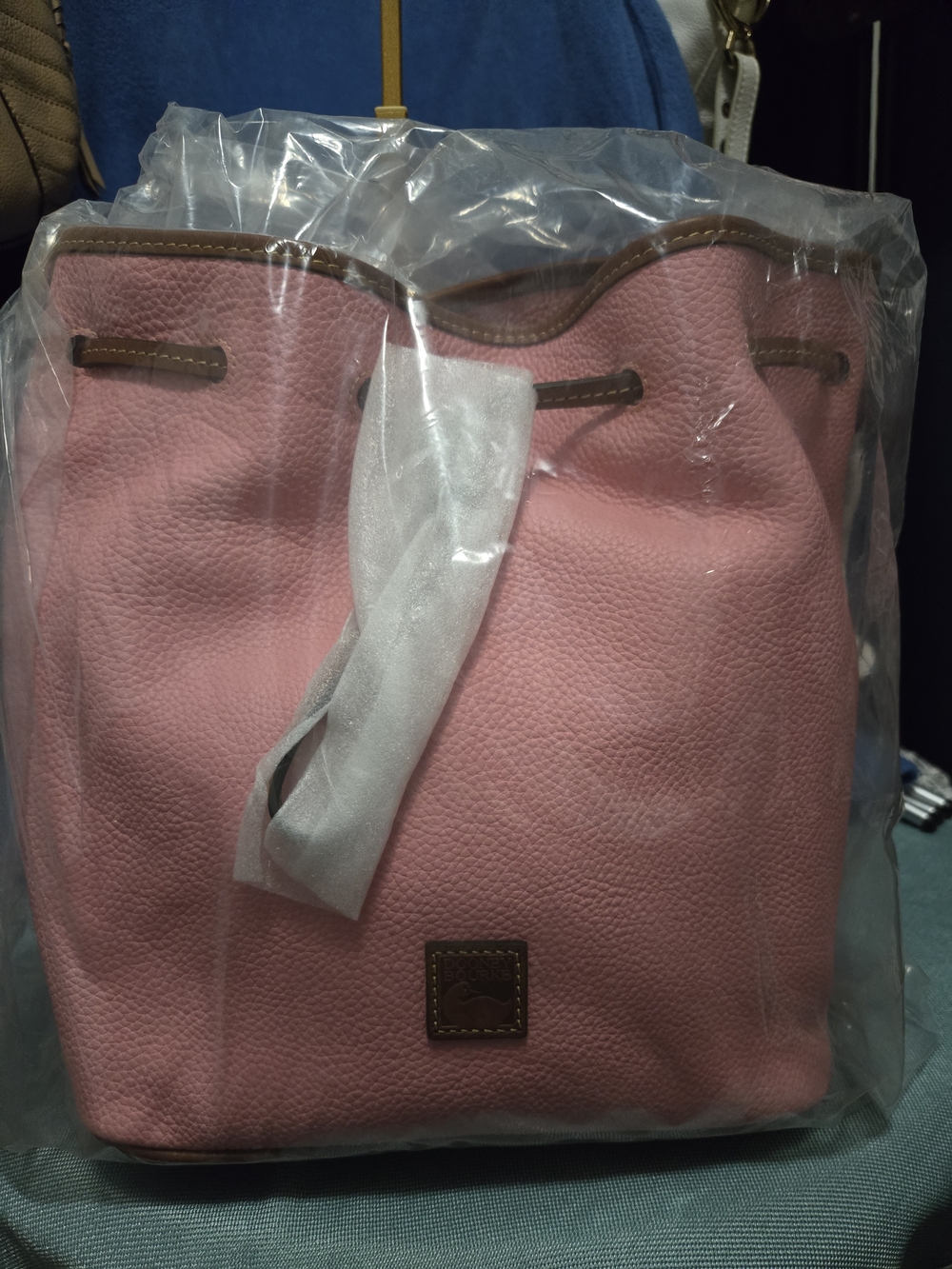 Dooney & Bourke Dusty Pink Pebbled Drawstring Bucket Bag with Brown Trim. NWT